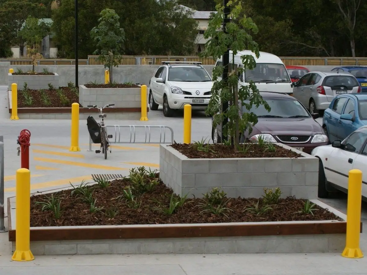 Several yellow bollards in the car park of WW Mullimbimby; heavy duty Bollards are constructed from high density, moulded polyethylene