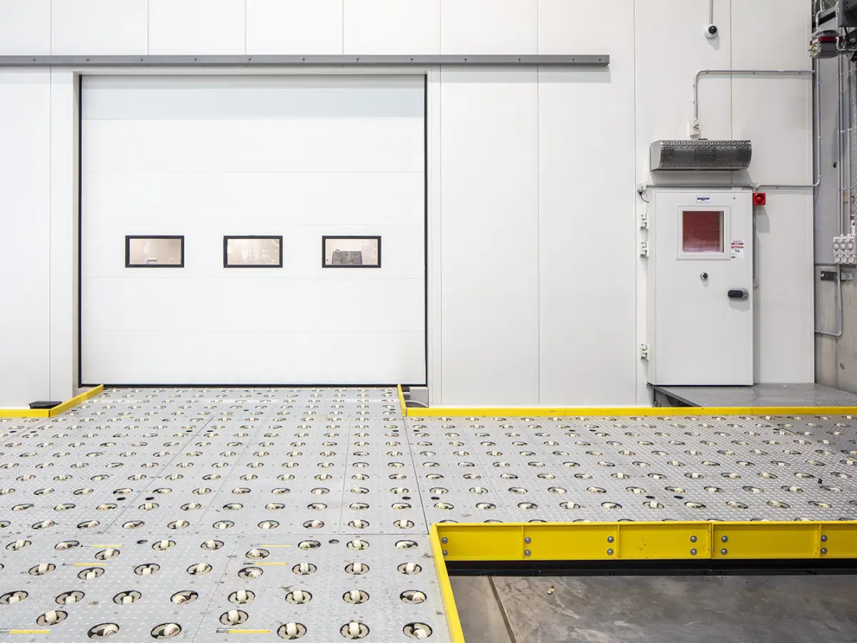 A closed sectional door inside a warehouse of DHL Brisbane Airport