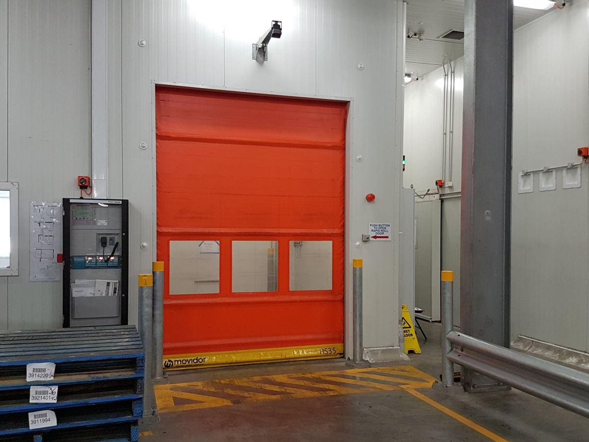 A large rapid roller door inside a factory.