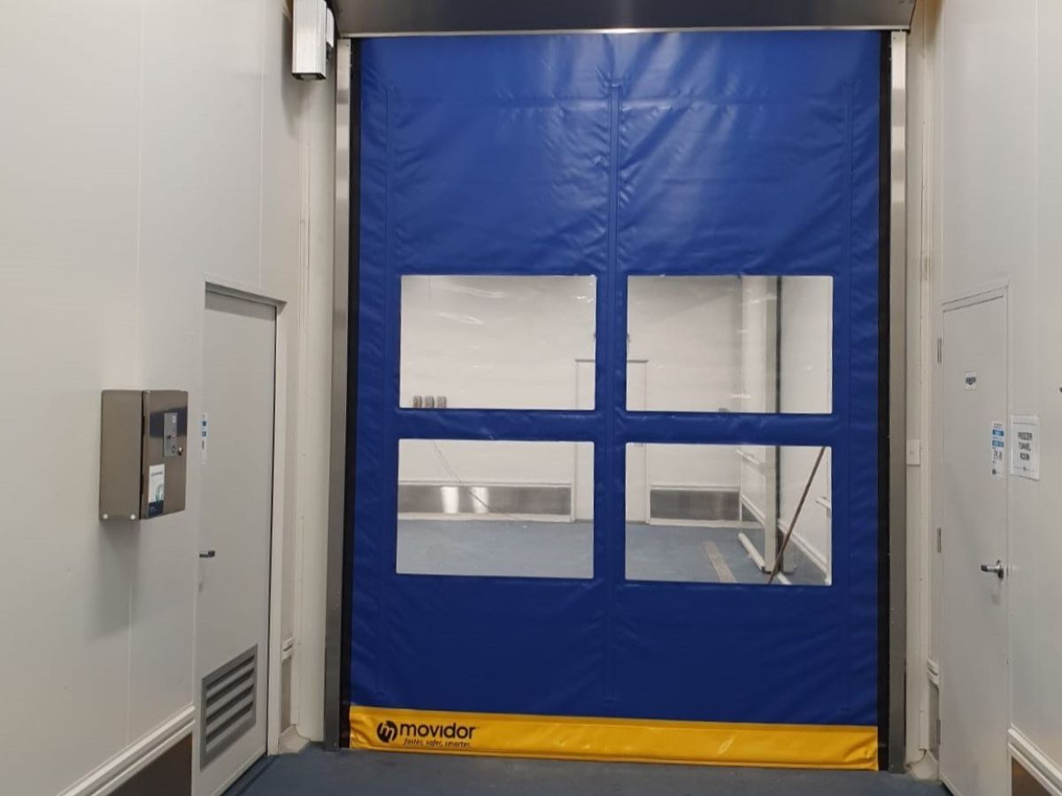 A closed rapid door inside a factory.