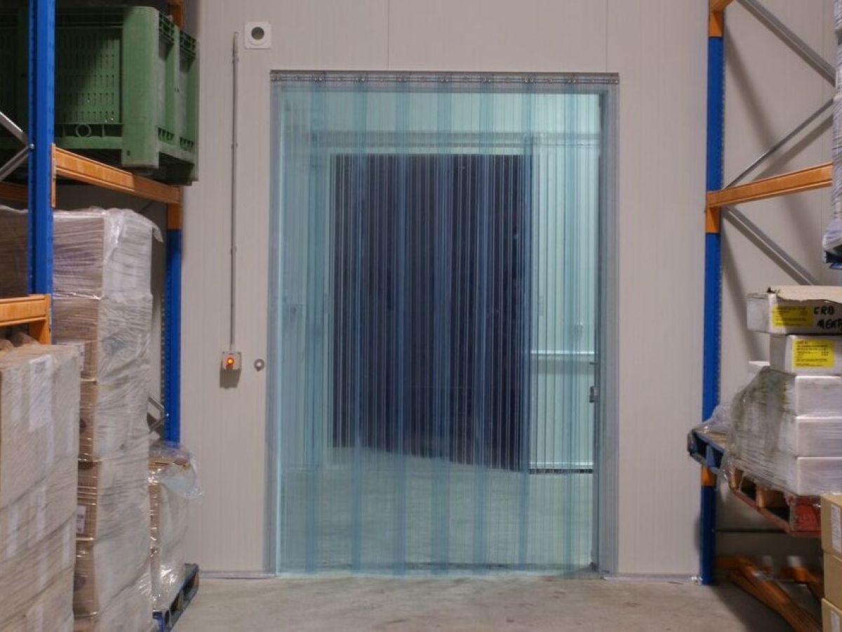 Strip curtains inside a freezer room in a warehouse.
