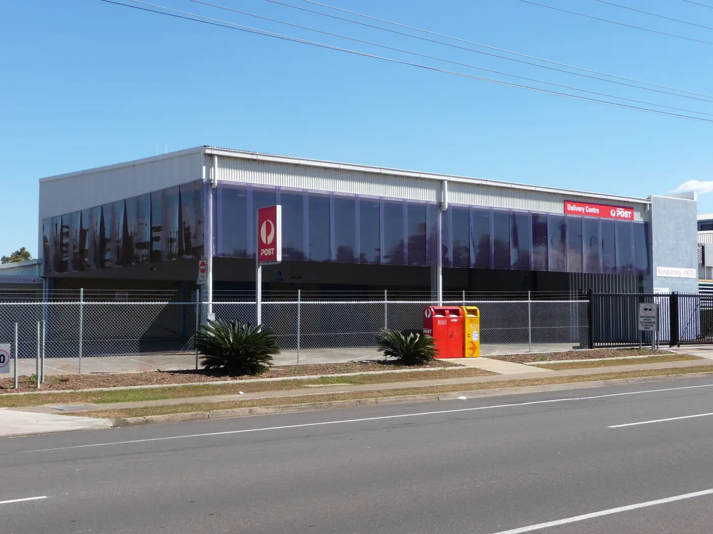 Short PVC strip curtains hanging from the roof of an industrial building, delivery centre of Australia Post