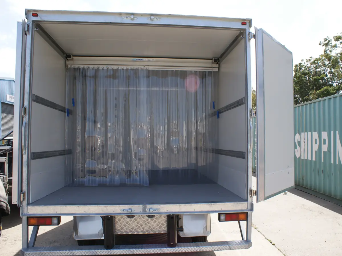 A Compass system; movable pvc strip curtain system inside a refrigerated truck.