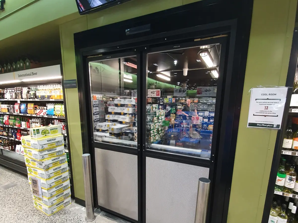 An automatic swing door inside Dan Murphy's