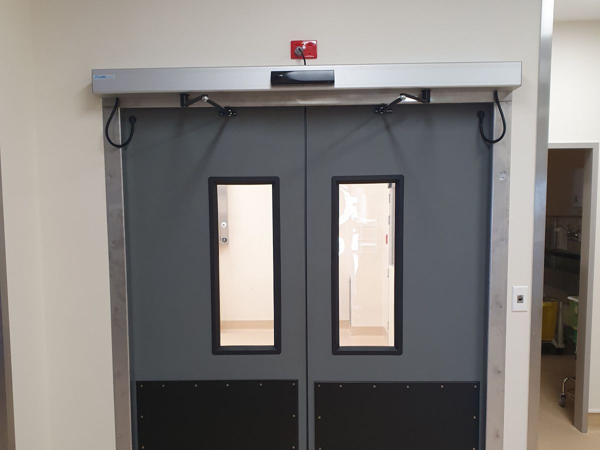 An automatic swing door inside a hospital.