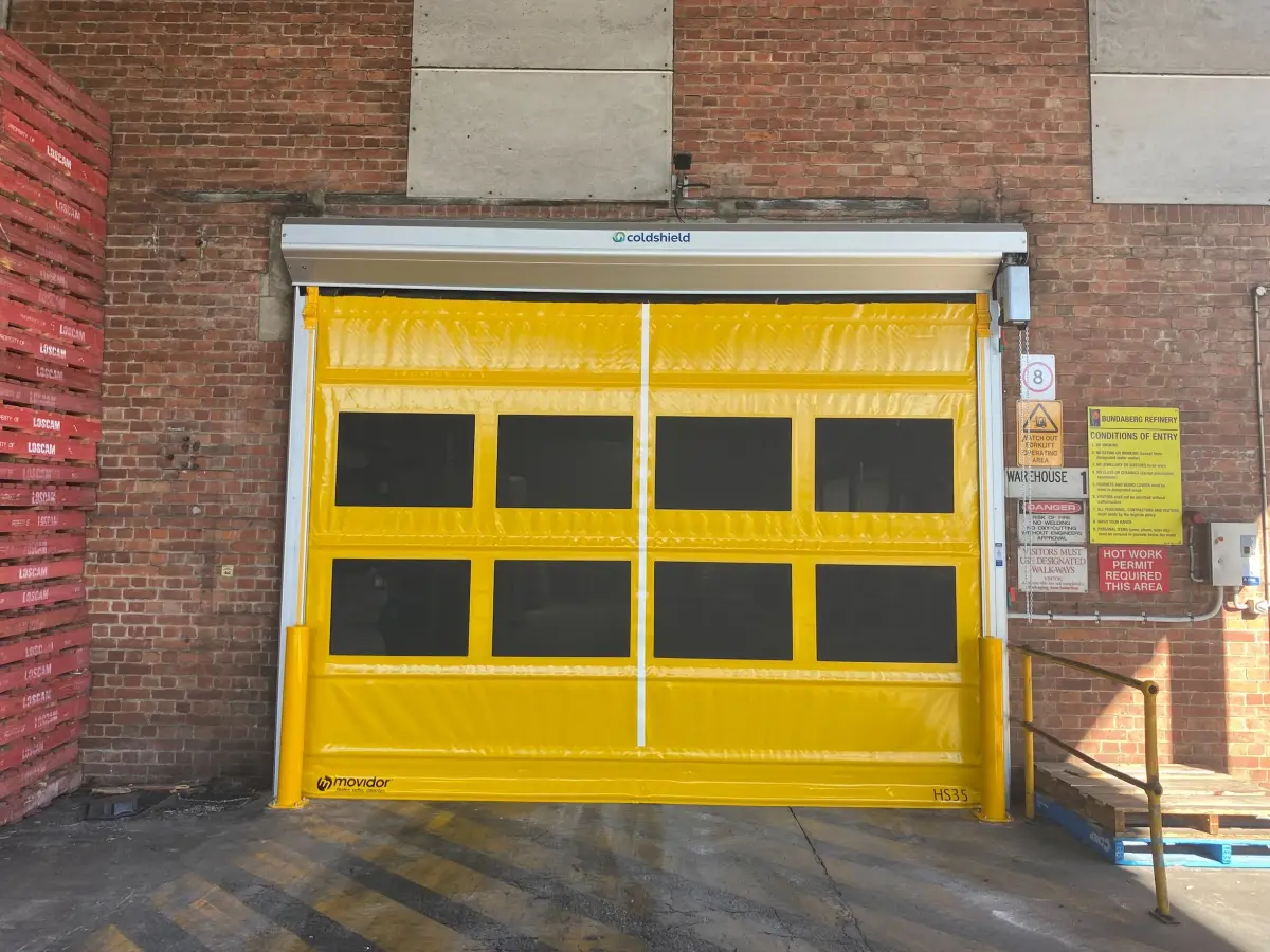 A large HS35 Movidor rapid roller door outside a factory of Bundaberg Sugar