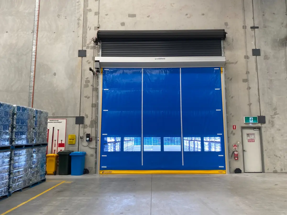 A large Movidor HS65 series high speed door inside a factory of Nu Pure Beverages