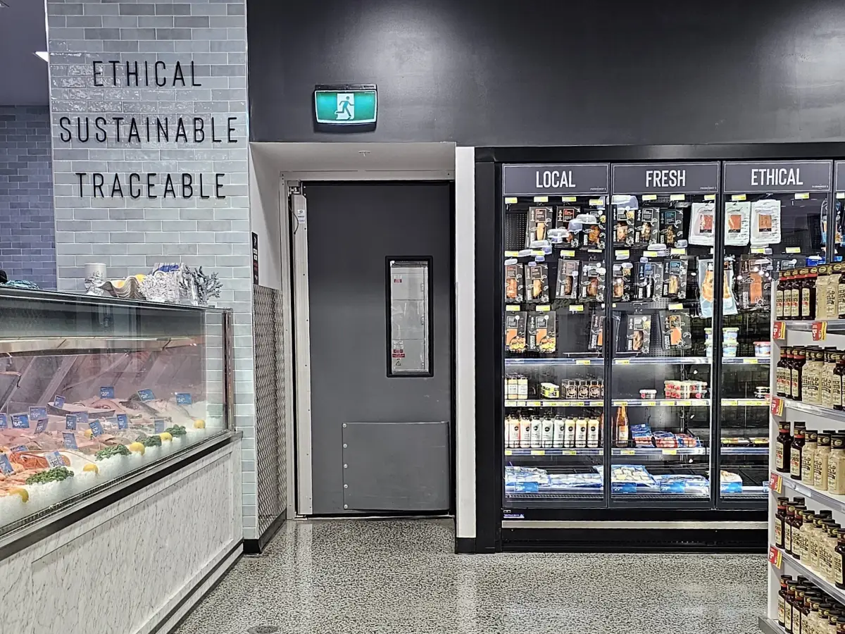 Coldshield 4500 series swing door inside IGA supermarket
