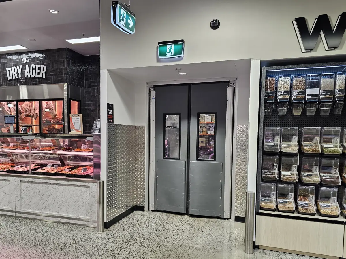 Coldshield 4500 series swing door inside IGA supermarket