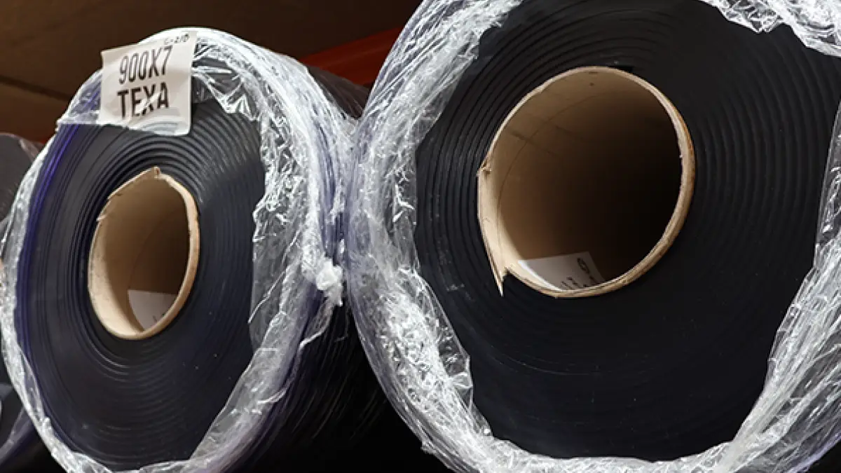 Texaflex variant of a PVC strip curtain roll, black colour.