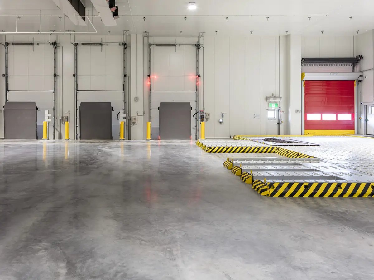 Interior of DHL Brisbane's fulfilment centre with Coldshield's insulated sectional doors and Movidor rapid roller door