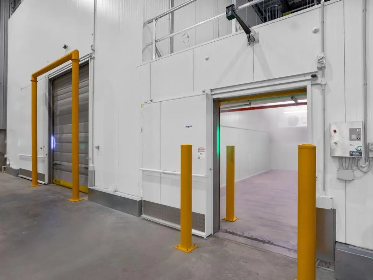 Interior of a pharmaceutical warehouse showing Movidor HS series high speed rapid roll doors in two custom sizes