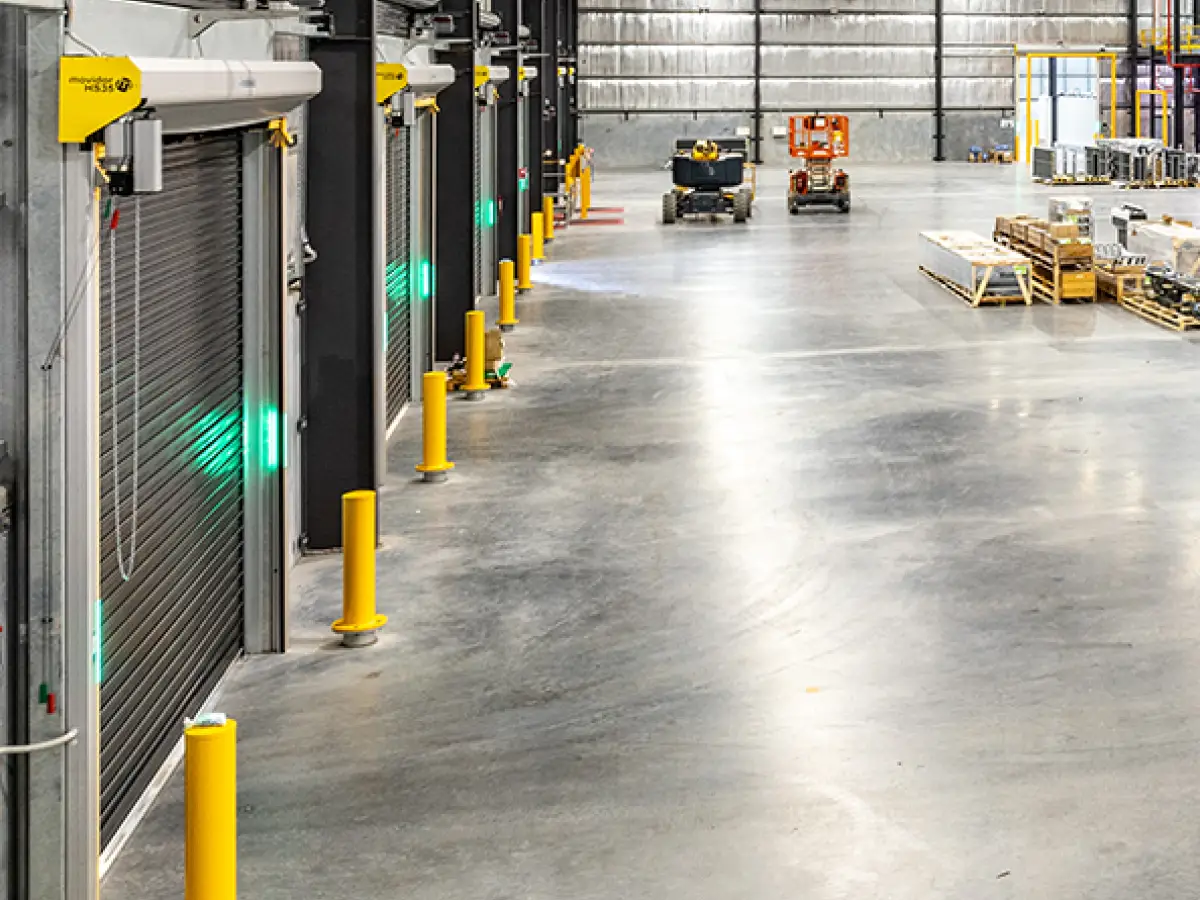 Interior of a pharmaceutical warehouse with several Movidor HS series high speed rapid roll doors