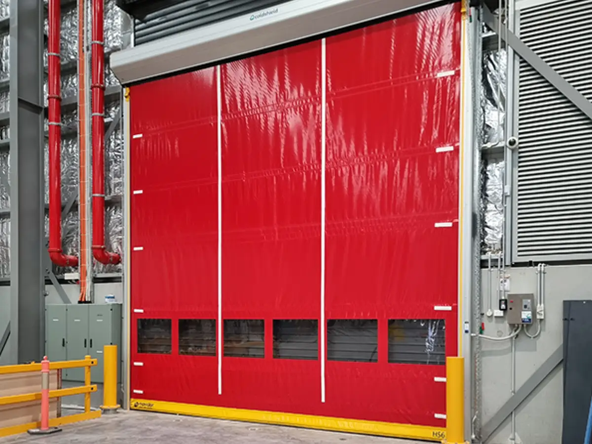 DHL Brisbane industrial warehouse with a Coldshield Movidor HS series high speed rapid door in front of a custom insulated sectional door