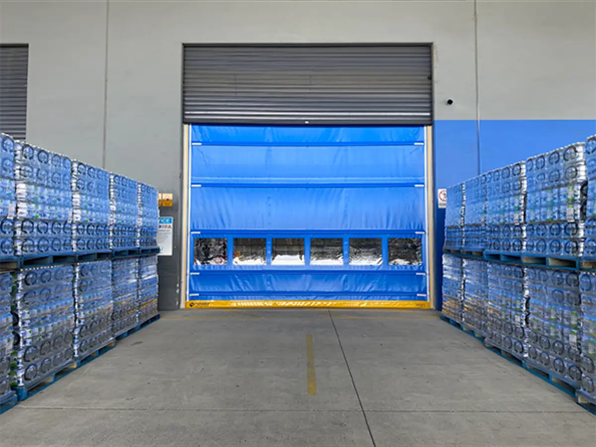 Coldshield HS series Movidor rapid roller door installed in front of a roller shutter at Nu Pure Beverages to meet HACCP standards while maintaining a dust- and pest-free environment