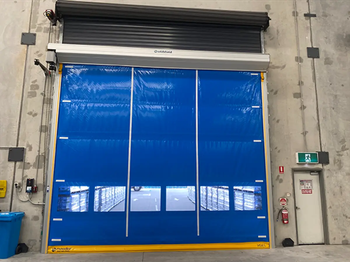 Coldshield HS series Movidor rapid roller door installed in front of a roller shutter at Nu Pure Beverages to meet HACCP standards while maintaining a dust- and pest-free environment
