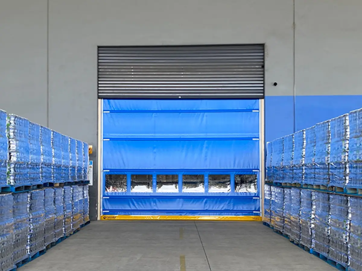 Coldshield HS series Movidor rapid roller door installed in front of a roller shutter at Nu Pure Beverages to meet HACCP standards while maintaining a dust- and pest-free environment