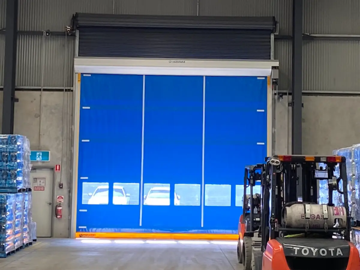 Coldshield HS series Movidor rapid roller door installed in front of a roller shutter at Nu Pure Beverages to meet HACCP standards while maintaining a dust- and pest-free environment
