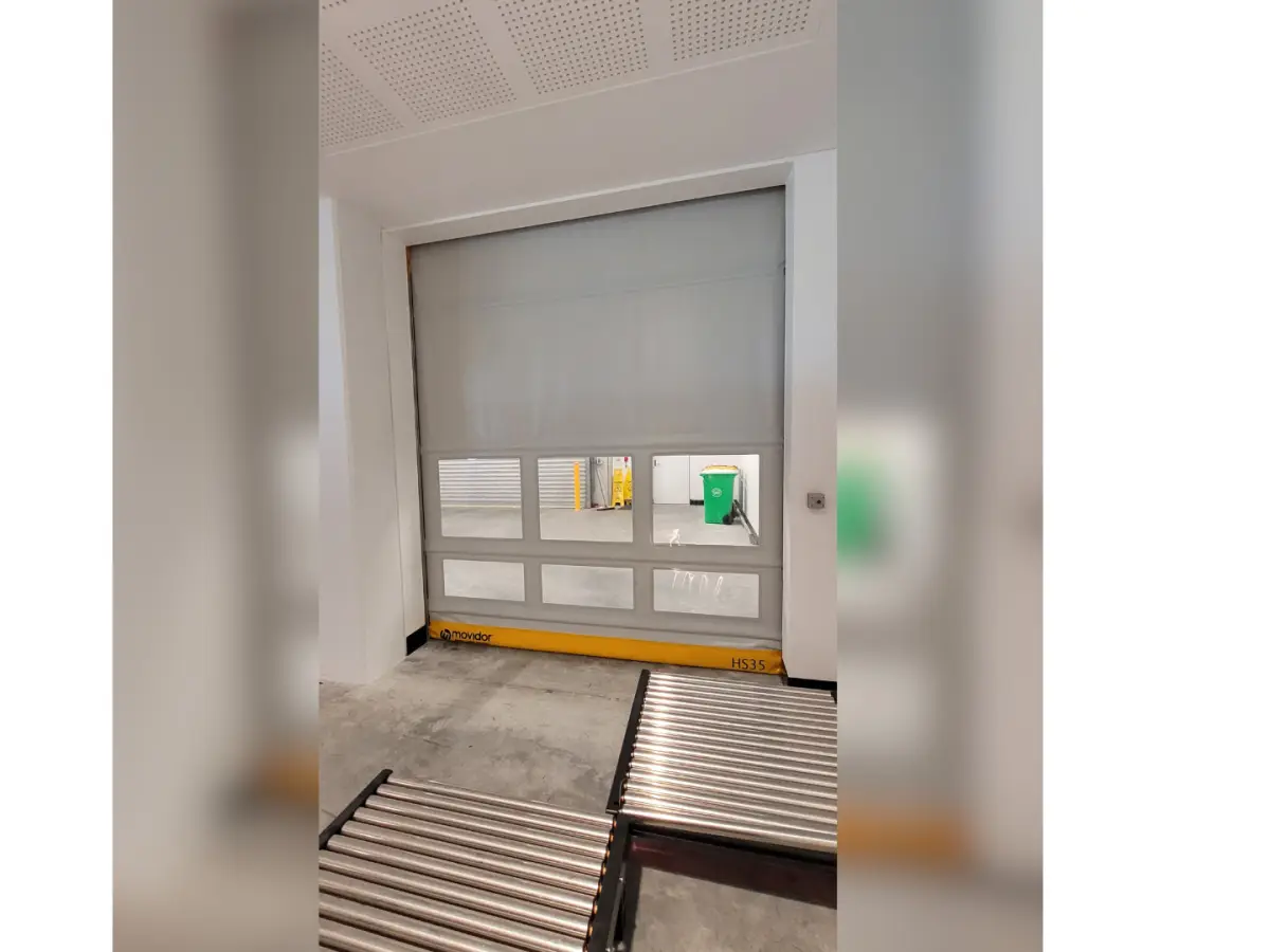 A grey Movidor rapid roller door with yellow bottom bar at the Port of Brisbane