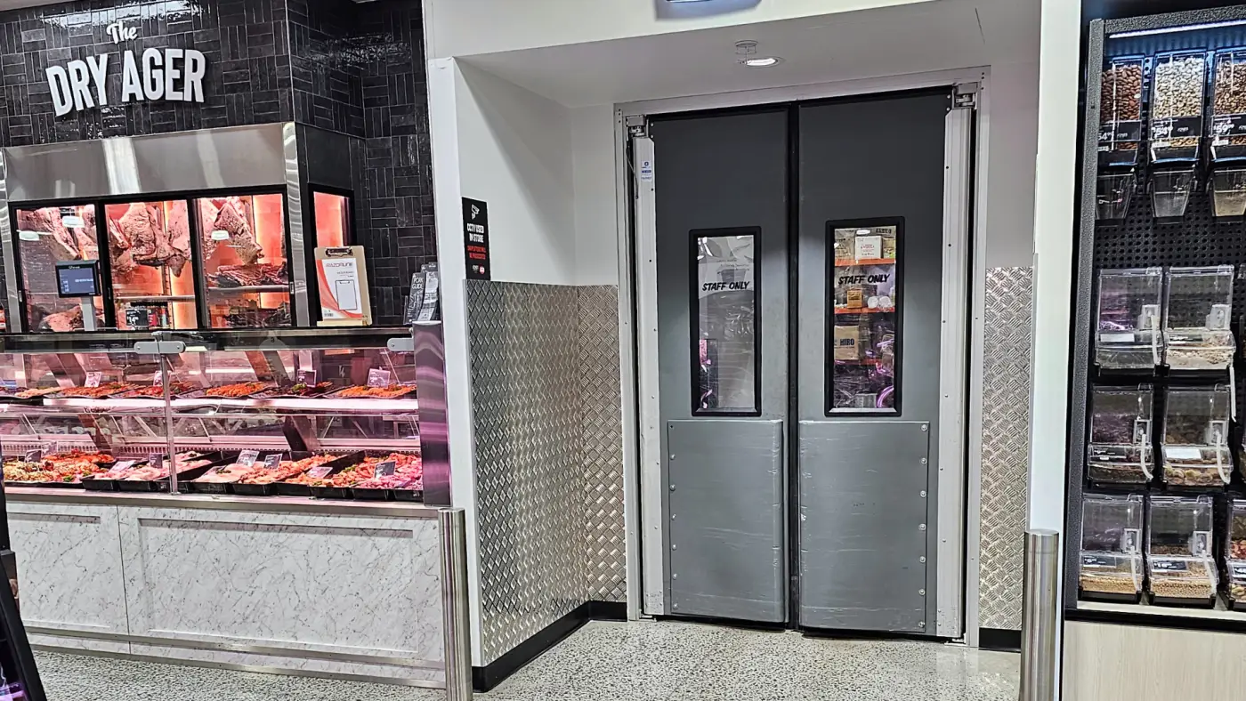 thermal swing doors with grey panels and buffers in food section