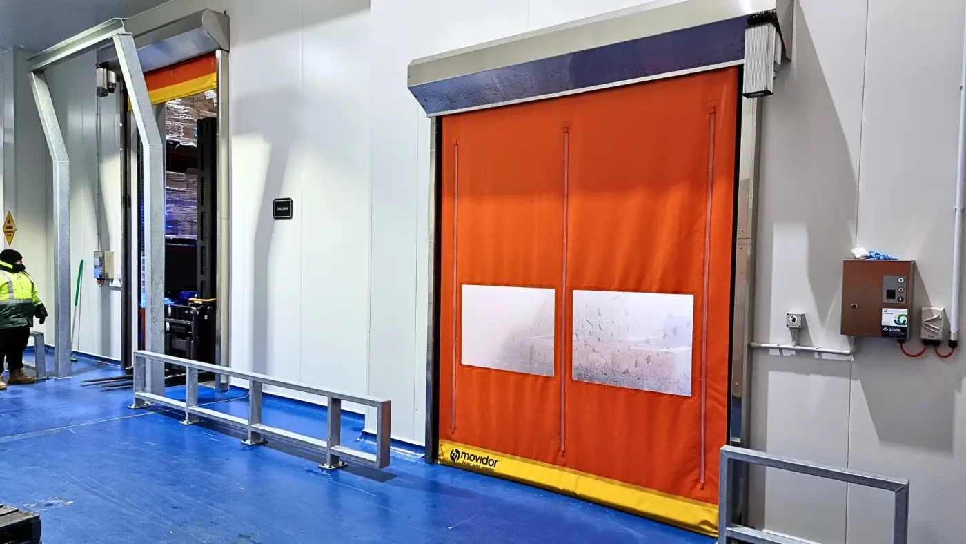 ex series rapid door with orange curtain in a food manufacturing site