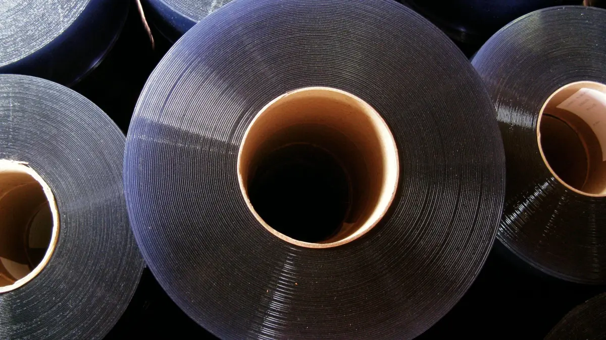 Premium PVC strip curtain roll in a warehouse - can be cut into plastic door strips and plastic screens.