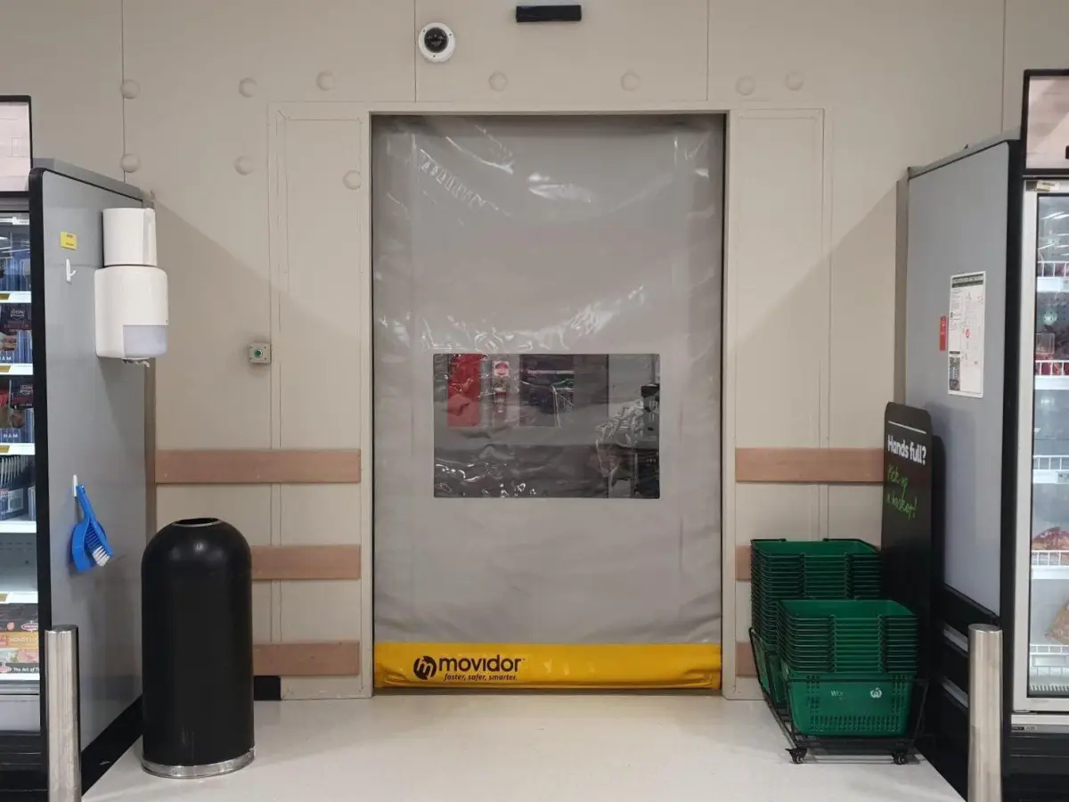 A grey custom tailored Movidor HS35 high speed rapid door with window inside WW Meadowbrook