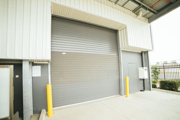 A closed roller shutter on an industrial building.