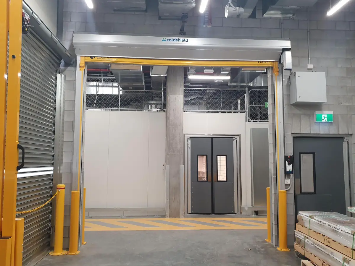 An open EX SERIES high speed rapid door with UPS backup battery power in the loading dock area of WW Montague West End
