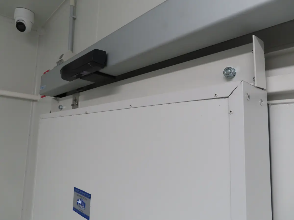 An automation sensor on an automatic sliding door inside a food production factory of Tasty Fresh
