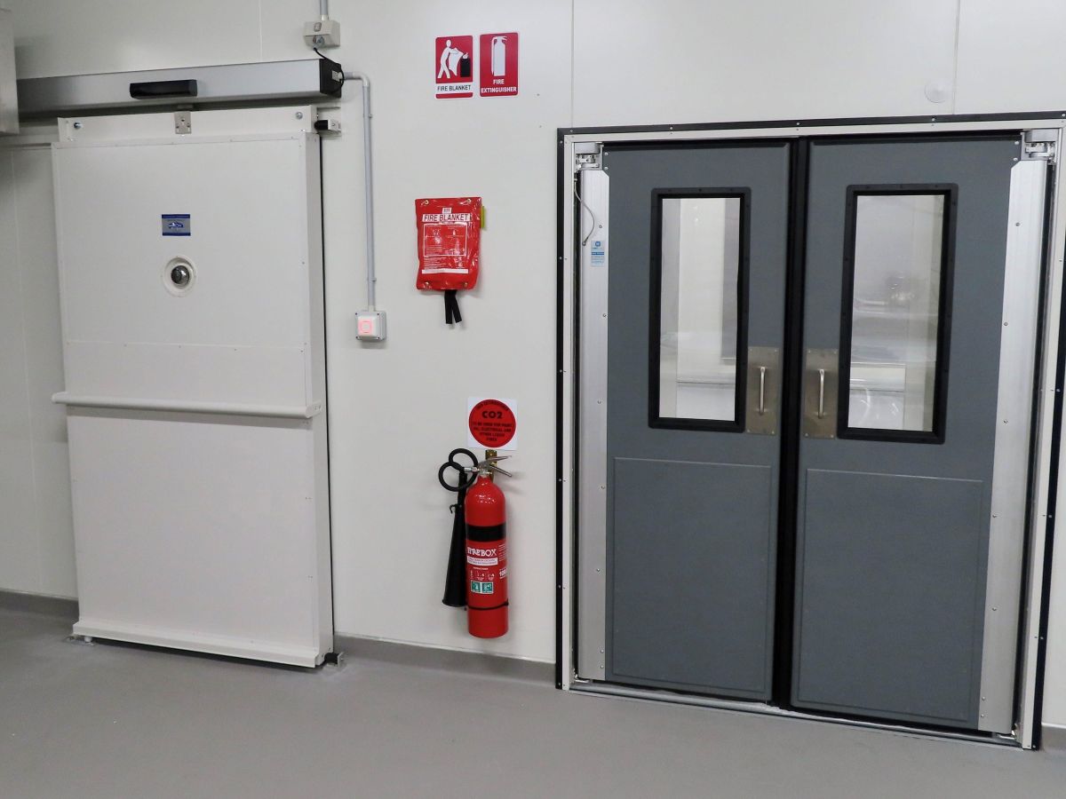 A traffic door and automated sliding door in a food processing factory.