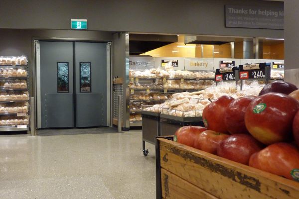 A closed traffic door in a supermarket.
