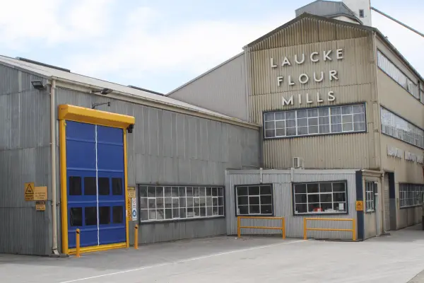 A blue Movidor HS65 rapid roller door outside an industrial building of Laucke Flour Mills SA