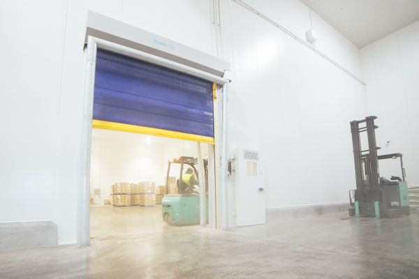 An open Movichill rapid roll door inside a cold storage facility.