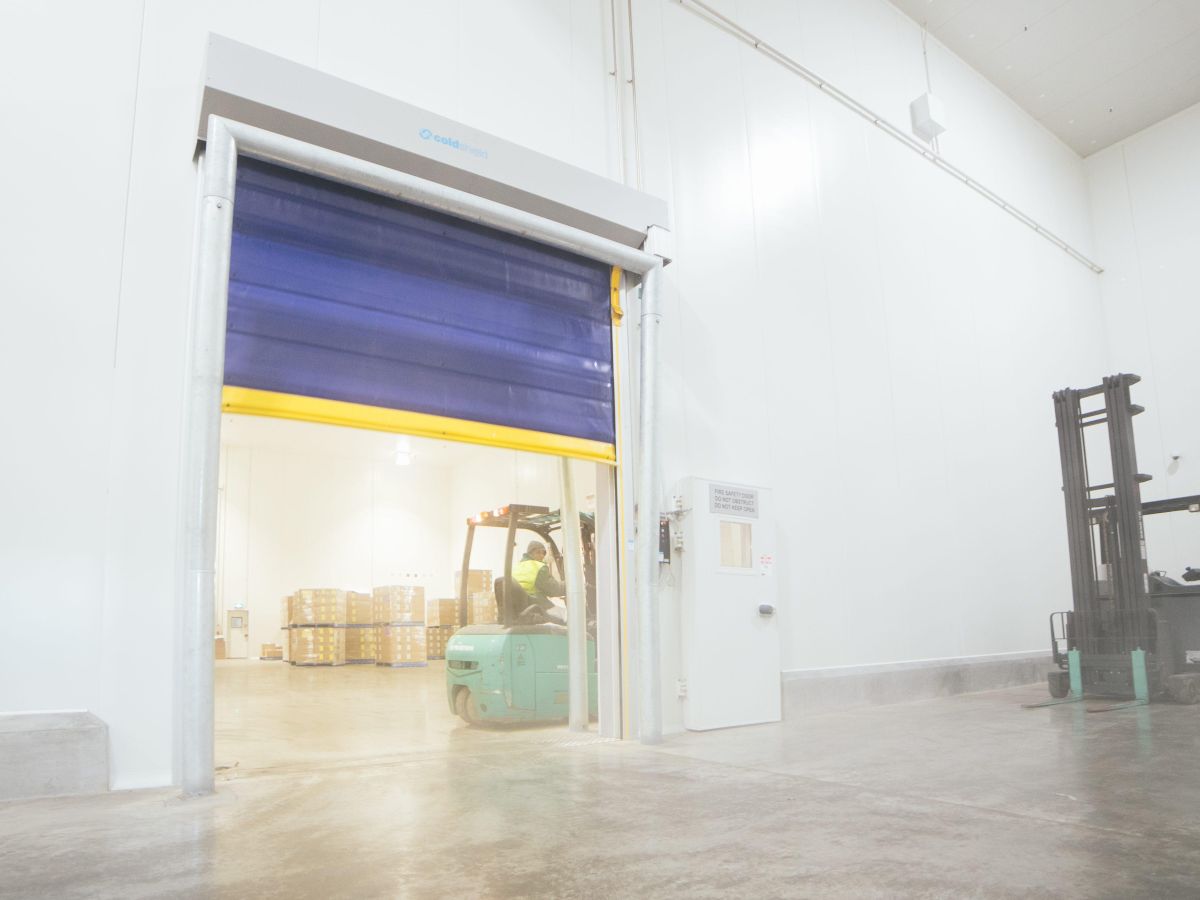 An open Movichill rapid roll door inside a cold storage facility.