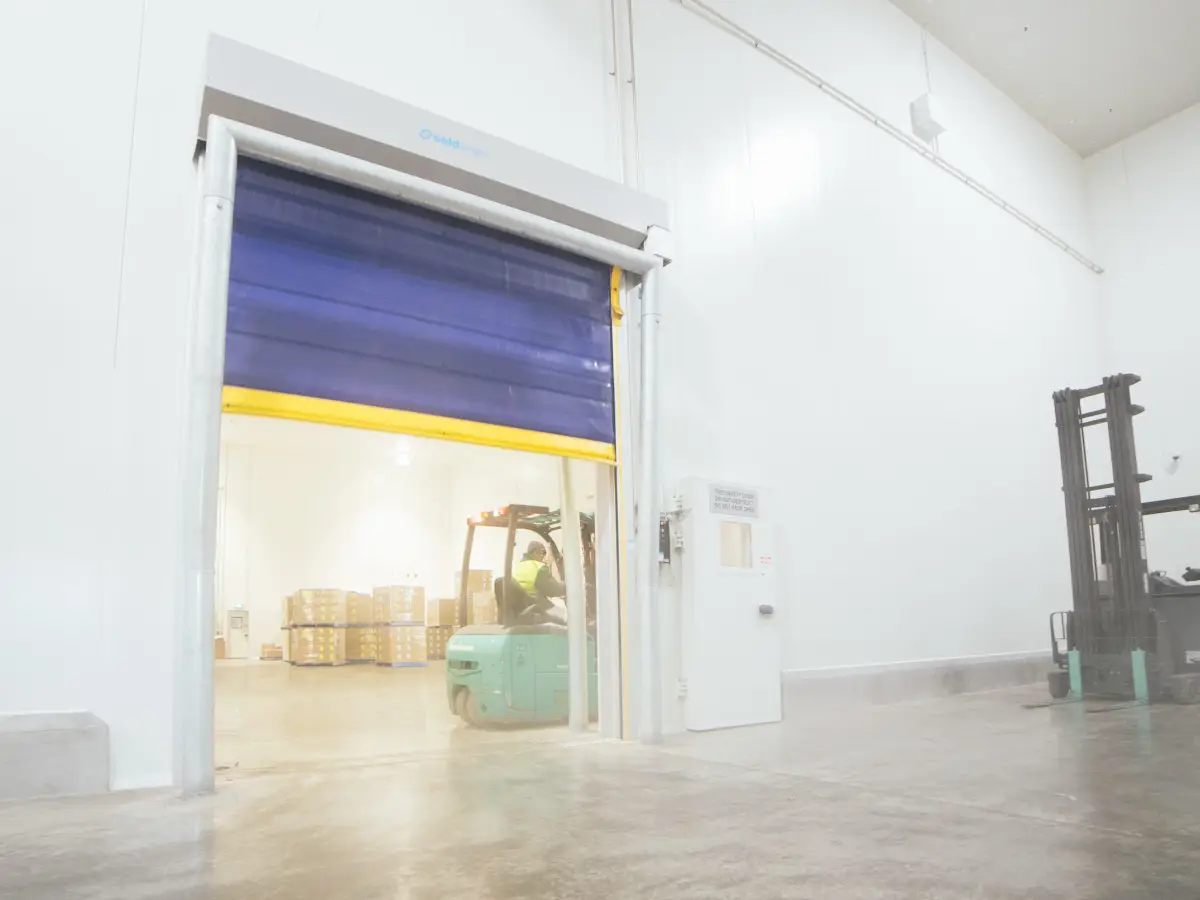 An open Movichill rapid roll door inside a cold storage facility.